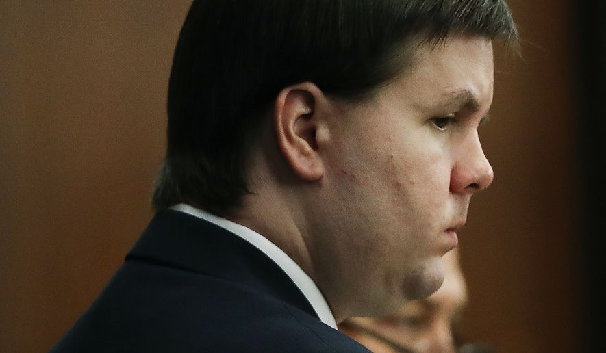 Justin Ross Harris, who is accused of intentionally killing his son in June 2014 by leaving him in the car in suburban Atlanta, stands during his murder trial Monday, Oct. 31, 2016, in Brunswick, Ga. (AP Photo/John Bazemore, Pool)