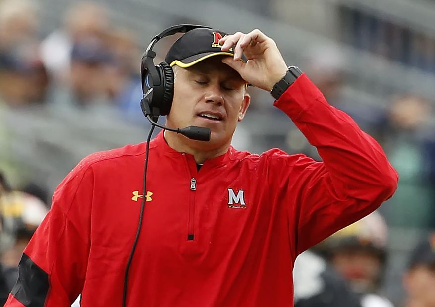 FILE - In this Oct. 8, 2016, file photo, Maryland head coach DJ Durkin reacts after Penn State scores during the second half of an NCAA college football game in State College, Pa. Durkin knew his first year at Maryland wasn't going to be easy. After absorbing a 59-3 spanking by No. 2 Michigan, the Terrapins now must prepare for sixth-ranked Ohio State. (AP Photo/Chris Knight, File) **FILE**