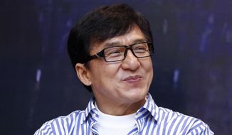 FILE - In this Dec. 18, 2013, file photo, Hong Kong actor Jackie Chan smiles during a news conference to promote his new film &amp;quot;Police Story 2013,&amp;quot; in Kuala Lumpur, Malaysia. On Saturday, Nov. 12, 2016, Chan will accept an honorary Academy Award from the film academy’s Board of Governors. (AP Photo/Lai Seng Sin, File)