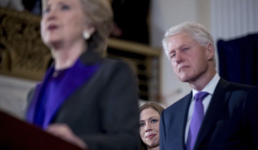 Democratic presidential candidate Hillary Clinton, left, accompanied by her husband former President Bill Clinton, right, and her daughter Chelsea Clinton, center, speaks in New York, Wednesday, Nov. 9, 2016, where she conceded her defeat to Republican Donald Trump after the hard-fought presidential election.  (AP Photo/Andrew Harnik)