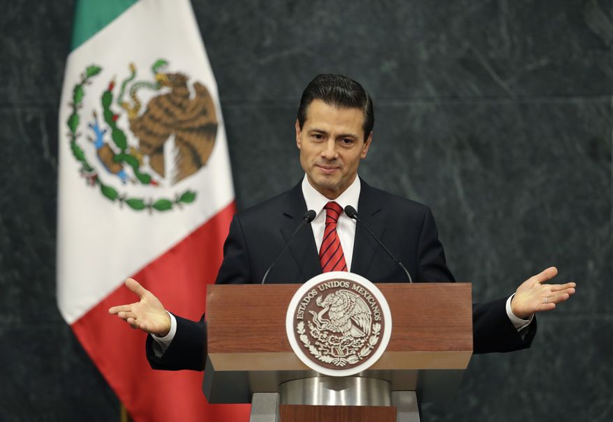 Mexico's President Enrique Pena Nieto gives an address in response to the U.S. presidential election in Mexico City, Wednesday, Nov. 9, 2016. The Mexican president said in a brief televised address that he has spoken with U.S. President-elect Donald Trump to congratulate him and his family. He said they agreed to meet during the transition period to discuss the U.S.-Mexico relationship. (AP Photo/Rebecca Blackwell)
