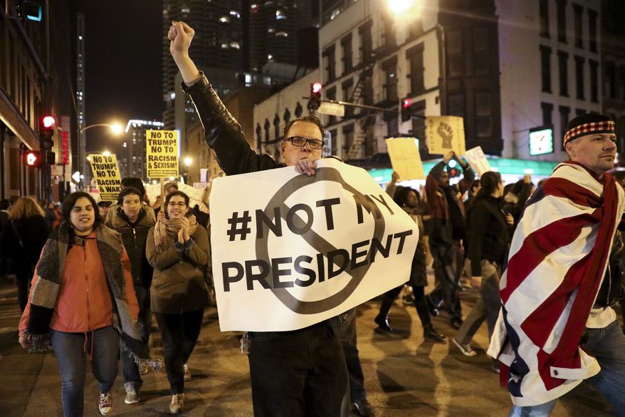 Protesters march in Chicago on Wednesday to express their disapproval of the election of Donald Trump. (Chicago Tribune via Associated Press)