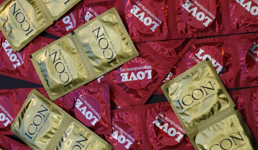 A sample of condoms distributed freely by the AIDS Healthcare Foundation in 28 countries is displayed at a news conference at the AHF headquarters in Los Angeles, in this Feb. 14, 2013, file photo. (AP Photo/Damian Dovarganes) ** FILE **