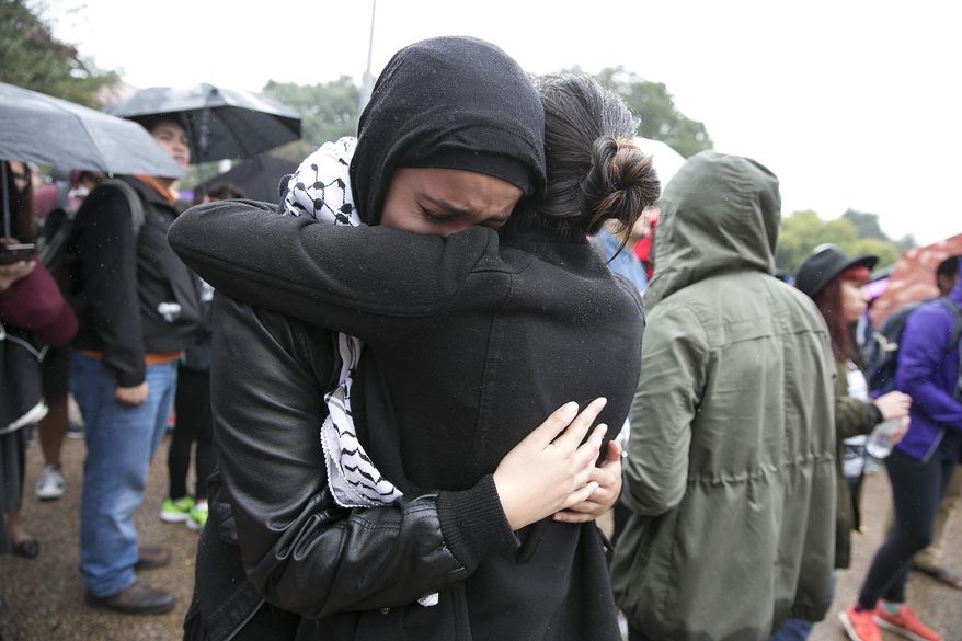 Noor Wadi, a second year law student, cries as she hugs a friend after speaking with fellow students gathered at the University of Texas at Austin to protest the Trump election on Wednesday, Nov. 9, 2016. Hundreds of University of Texas students march through downtown Austin in protest of Donald Trump's presidential victory.(Deborah Cannon/Austin American-Statesman via AP)