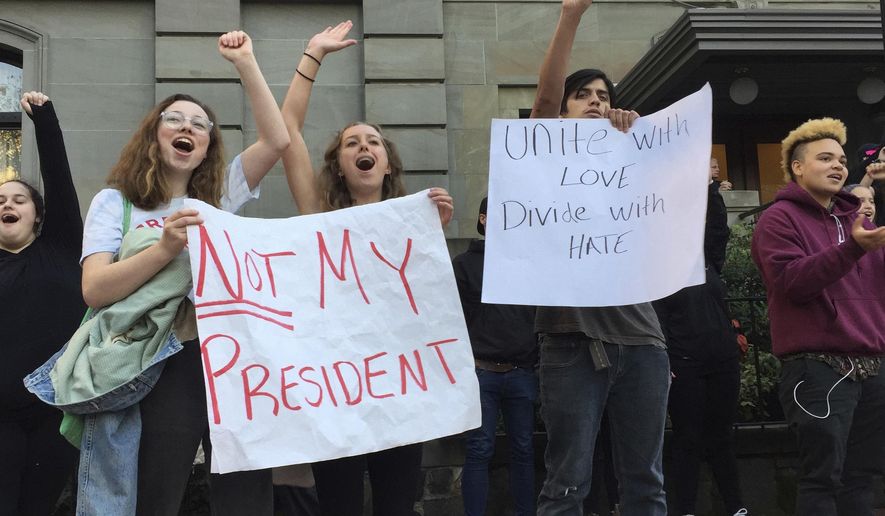 Several dozen students from various high schools in the Portland, Ore., metropolitan area gather downtown to protest Republican nominee Donald Trump&#39;s victory in Tuesday’s presidential election, Wednesday, Nov. 9, 2016. The protests were peaceful and students said that they felt compelled to demonstrate against Trump because they were not old enough to vote. (AP Photo/Gillian Flaccus)