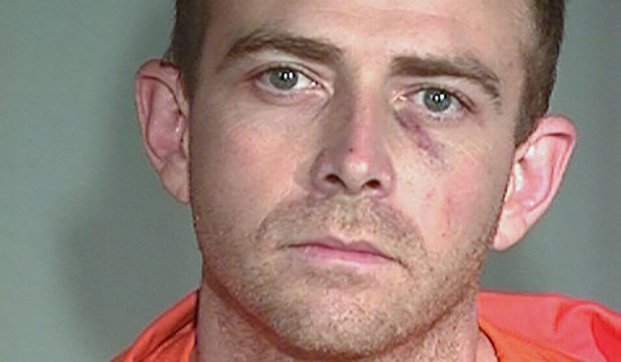 This photo provided by the Arizona Department of Corrections shows former inmate Daniel Erickson. Erickson, accused of killing a police officer and holing up in an eastern Arizona cabin with a teenage girl believed to have been a hostage, was shot dead Wednesday, Nov. 9, 2016, by officers after the suspect opened fire, authorities said. The shooting of Erickson came after he pulled a gun Tuesday, Nov. 8, and shot Officer Darrin Reed of the Show Low police department when Read was responding to a report of a disturbance at a restaurant, the department said in a statement. (Arizona Department of Corrections via AP)