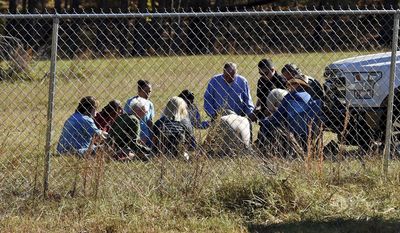 Duncan First Baptist church members,with South Carolina State Rep. Bill Chumley, hold a prayer service on Todd Kohlhepp&#39;s property in Woodruff, S.C. Monday, Nov. 7, 2016. Kohlhepp was arrested for kidnapping a woman and keeping her in a storage container on his property. He is also charged with four counts of murder at Superbike Motorsports in Chesnee, S.C. in 2003.  (AP Photo/Richard Shiro)