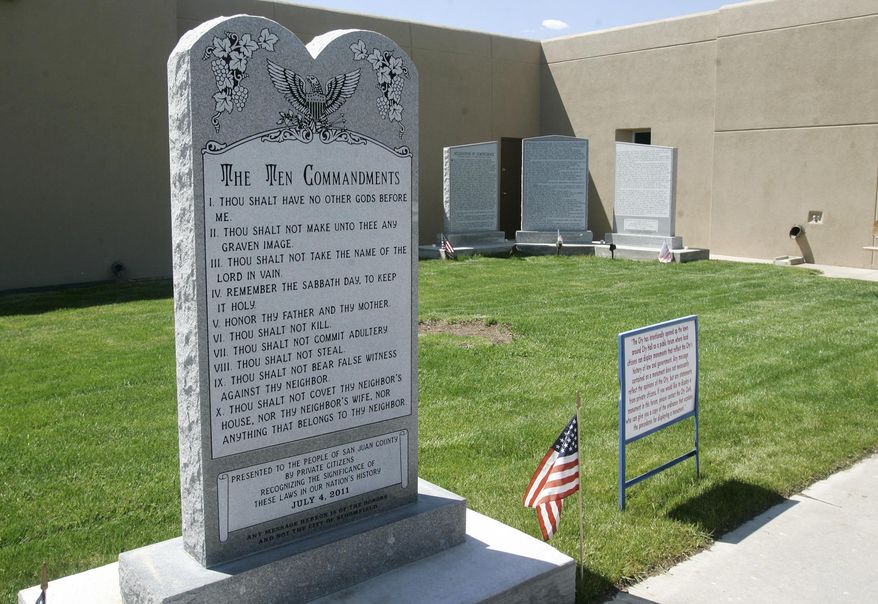 This May 15, 2012, photo shows the Bloomfield Ten Commandments monument at the City Hall in Bloomfield, N.M. An attorney for Bloomfield says the northwestern New Mexico city will consider whether to appeal a court ruling that the town's Ten Commandments monument violates the U.S. Constitution. (Jon Austria/The Daily Times via AP) MANDATORY CREDIT