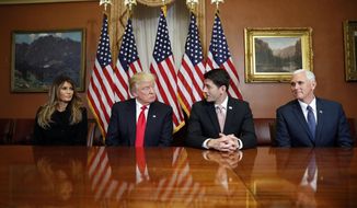 President-elect Donald Trump, his wife Melania and Vice president-elect Mike Pence, pose for photographers with House Speaker Paul Ryan of Wis. after a meeting in the Speaker&#39;s office on Capitol Hill in Washington, Thursday, Nov. 10, 2016. (AP Photo/Alex Brandon)
