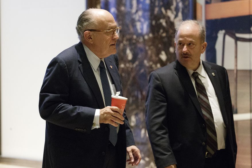 Former New York Mayor Rudy Giuliani, an adviser to President-elect Donald Trump, left, arrives at Trump Tower, Friday, Nov. 11, 2016, in New York. (AP Photo/ Evan Vucci)