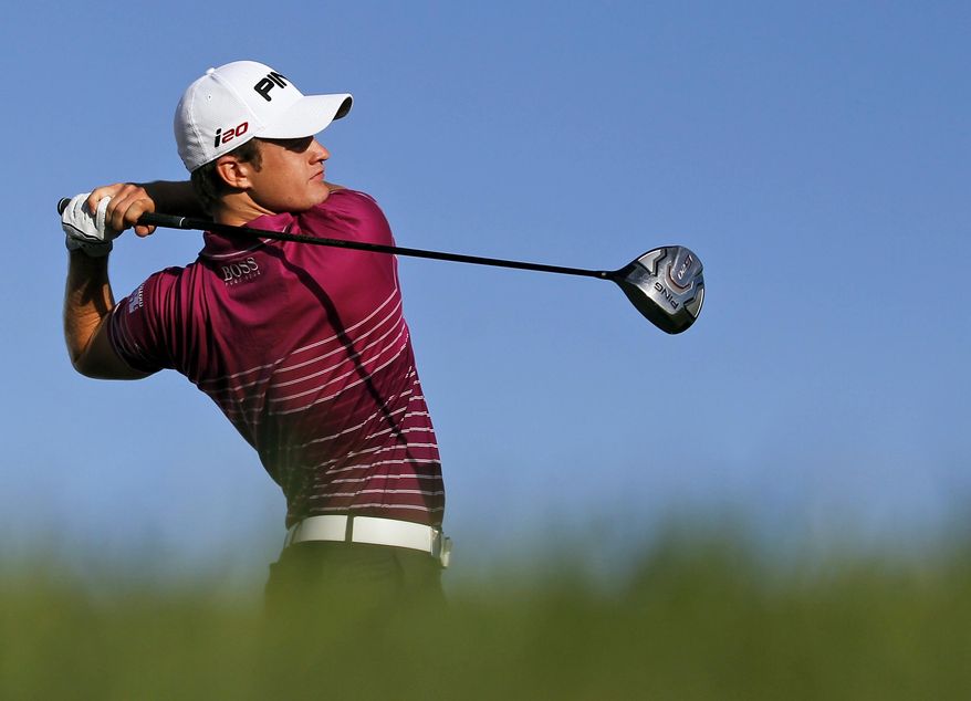 FILE - A Thursday, Oct. 11, 2012 file photo of Tom Lewis, from Britain, teeing off from the 14th hole during the first round of the Portugal Master golf tournament at the Victoria golf course in Vilamoura, southern Portugal. Next Thursday, Nov. 17, 2016, 5,000 miles away from the opening round of the European Tour’s lucrative, season-ending World Tour Championship in Dubai, the final stage of the tour’s Q School will reach its climax just outside Barcelona. (AP Photo/Francisco Seco, File)