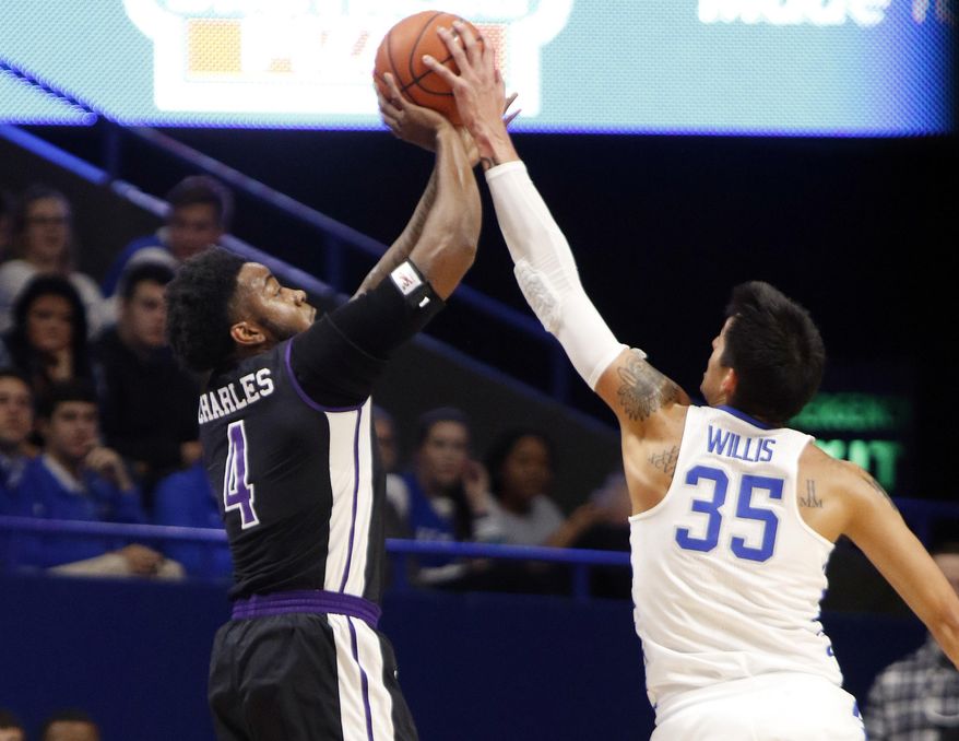 Kentucky's Derek Willis (35) blocks the shot of Stephen F. Austin's Ty Charles during the first half of an NCAA college basketball game, Friday, Nov. 11, 2016, in Lexington, Ky. (AP Photo/James Crisp)
