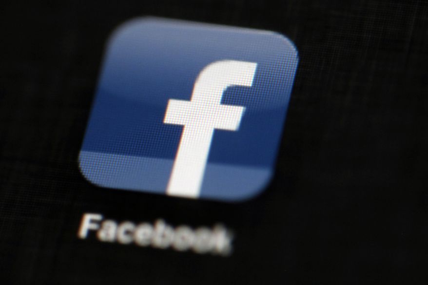 FILE - In this May 16, 2012, file photo, the Facebook logo is displayed on an iPad in Philadelphia. Responding to criticism, Facebook says it will no longer allow advertisers to use ethnicity as a filter when it comes to targeting or hiding ads offering housing, employment or credit. The changes come after a report by ProPublica found that Facebook’s system lets advertisers exclude black, Hispanic or other so-called 'ethnic affinities’ from seeing their ads. (AP Photo/Matt Rourke, File)