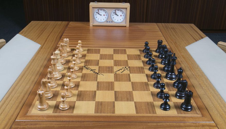 This undated photo provided by Heritage Auctions shows the chess board used by American Bobby Fischer and Soviet champ Boris Spassky during their historic 1972 &amp;quot;Match of the Century,&amp;quot; a tournament that sealed Fischer&#39;s fate as the world chess champion. The board, used in games 7 through 21 at the Reykjavik, Iceland, championship is slated to be auctioned in New York City on Nov. 18 by Heritage Auctions, which has set an opening bid of $75,000. (Heritage Auctions via AP)