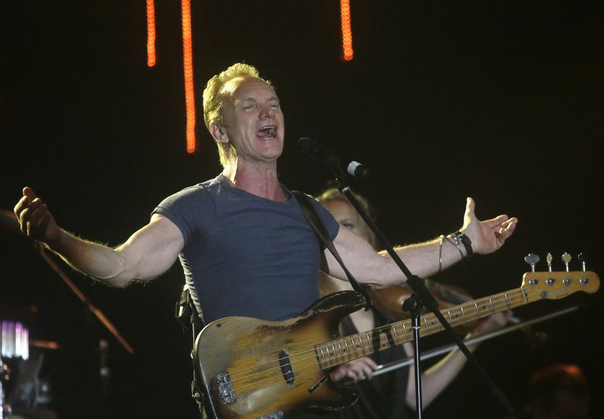 FILE - In this March 5, 2016 file photo, musician Sting performs during a concert at the Java Jazz Festival in Jakarta, Indonesia. A concert by British pop legend Sting is marking the reopening of the Paris’ Bataclan concert hall one year after suicidal jihadis turned it into a bloodbath and killed 90 revelers with automatic weapons and explosive belts. (AP Photo/Tatan Syuflana, File)