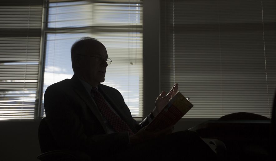 Second District Court Judge Thomas L. Kay reads his poem "The Shot," which he wrote about a basketball game his son played, at the Second District Court House in Bountiful, Utah on Monday, Oct. 31, 2016. Judge Kay recently published a collection of his poems called "The Road I've Taken." (Briana Scroggins/Standard-Examiner via AP)