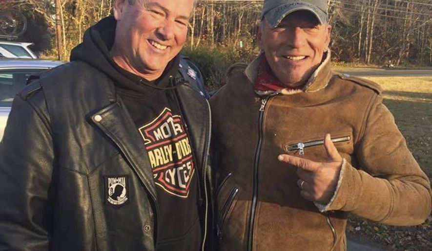 In this Friday, Nov. 11, 2016, photo provided by Ryan Bailey, Dan Barkalow, left, and Bruce Springsteen poses for a photo in Wall Township, N.J. Barkalow and a group from the Freehold American Legion was riding after a Veterans Day event Friday when they pulled over to help a stranded motorcyclist who turned out to be The Boss. (Ryan Bailey via AP)