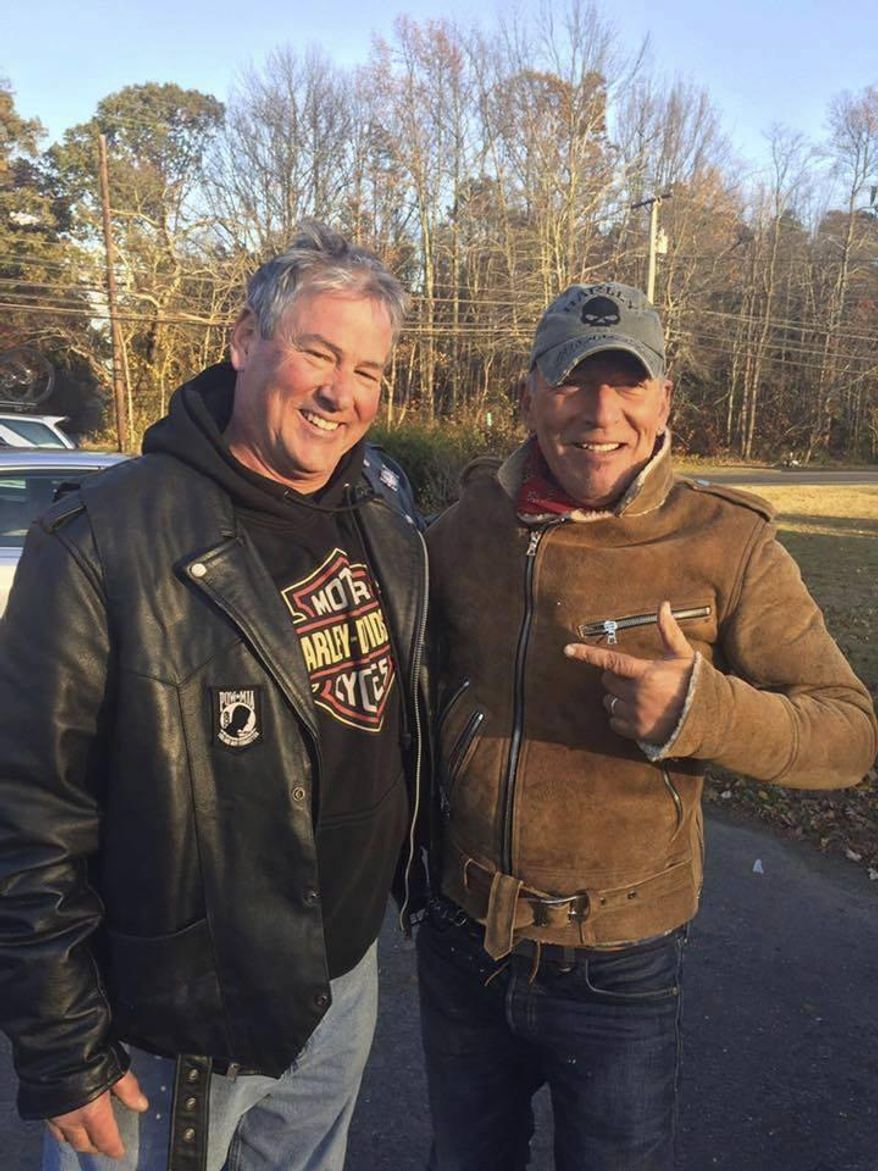 In this Friday, Nov. 11, 2016, photo provided by Ryan Bailey, Dan Barkalow, left, and Bruce Springsteen poses for a photo in Wall Township, N.J. Barkalow and a group from the Freehold American Legion was riding after a Veterans Day event Friday when they pulled over to help a stranded motorcyclist who turned out to be The Boss. (Ryan Bailey via AP)