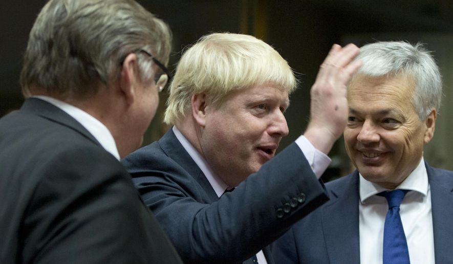 British Foreign Secretary Boris Johnson, center, speaks with Belgian Foreign Minister Didier Reynders, right, and Finnish Foreign Minister Timo Juhani Soini, left, during a meeting of EU foreign ministers at the EU Council building in Brussels on Monday, Nov. 14, 2016. EU foreign ministers meet Monday to discuss strained ties with Turkey and trans-Atlantic ties after the U.S. election results. (AP Photo/Virginia Mayo)