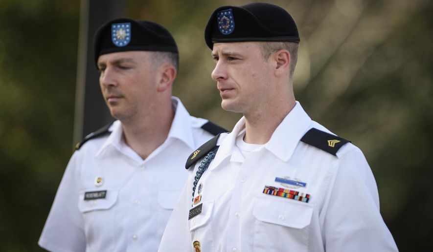 FILE - In a July 7, 2016 file photo, Sgt. Bowe Bergdahl, right, arrives with his military lawyer, Lt. Col. Franklin Rosenblatt, for a legal hearing at the courtroom facility, on Fort Bragg, N.C.  A military judge is delaying the trial of Bergdahl on charges of desertion and misbehavior before the enemy. Army Col. Jeffery Nance decided to push the trial back to May 2017 during a pretrial hearing Monday, Nov. 14, at Fort Bragg in North Carolina. The trial had been scheduled for February. (Andrew Craft/The Fayetteville Observer via AP, File)