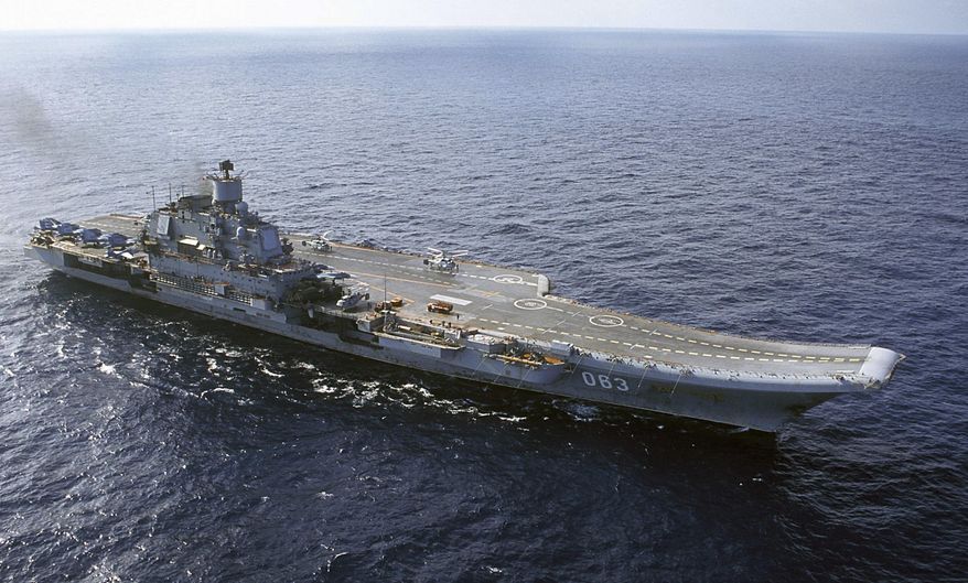 FILE - In this 2004 file photo the Admiral Kuznetsov carrier seen in the Barents Sea, Russia. The Russian military says one of its the MiG-29 fighter jets based at a Russian aircraft carrier currently near Syria's shores has crashed on a training mission, but its pilot has survived. (AP Photo, File)