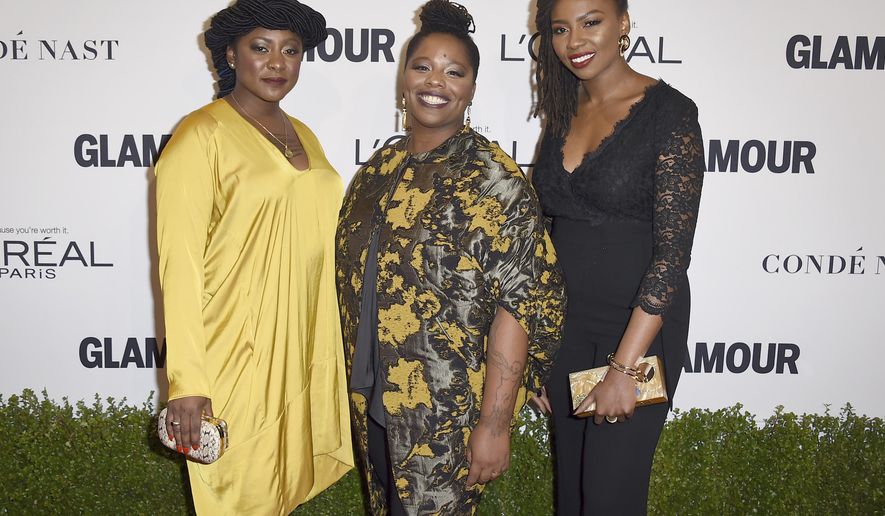 Alicia Garza, from left, Patrisse Cullors and Opal Tometi, co-founders of the Black Lives Matter movement, arrive at the Glamour Women of the Year Awards at NeueHouse Hollywood on Monday, Nov. 14, 2016, in Los Angeles. (Photo by Jordan Strauss/Invision/AP)