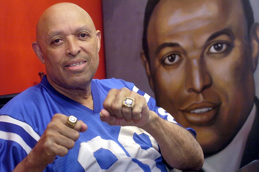 National Football League Hall of Famer John Mackey shows off his Hall of Fame and Super Bowl V rings Thursday, March 22, 2007 at his Baltimore home. Mackey, who spent nine years of his 10-year career with the Baltimore Colts, now struggles with dementia. (AP Photo/ Steve Ruark)
