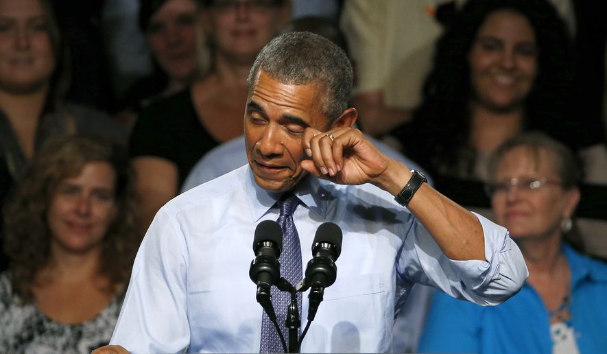 President Barack Obama pretends to wipe a tear during his speech at Macomb County Community College Wednesday, Sept. 9, 2015, in Warren, Mich. The president said he&#39;s &quot;a little freaked out&quot; that his oldest daughter, Malia, just started her senior year in high school. (AP Photo/Paul Sancya)