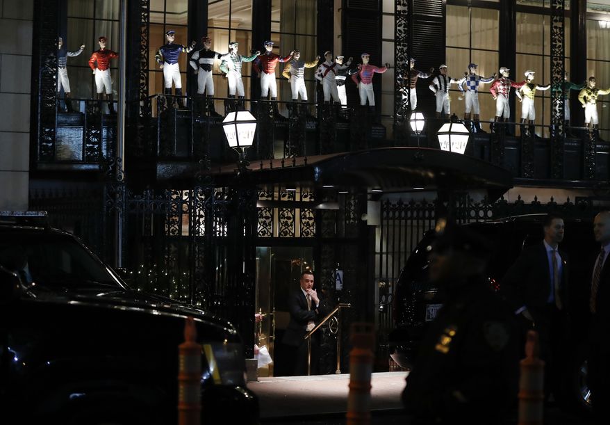 The motorcade of President-elect Donald Trump and security personnel are seen outside 21 Club Restaurant, Tuesday, Nov. 15, 2016, in New York. (AP Photo/Carolyn Kaster)