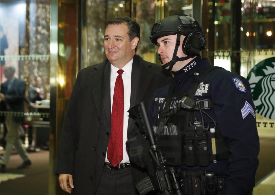 Sen. Ted Cruz, R-Texas, poses for a photo with a member of law enforcement as he leaves Trump Tower, Tuesday, Nov. 15, 2016, in New York. (AP Photo/Carolyn Kaster)