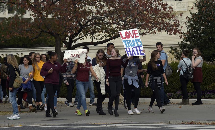 Washington area high school students protest near the Supreme Court in Washington, Tuesday, Nov. 15, 2016. Hundreds of demonstrators are gathered outside the Supreme Court to protest Donald Trumps election. They are mostly young people who appear to have walked out of school to protest. (AP Photo/Susan Walsh)