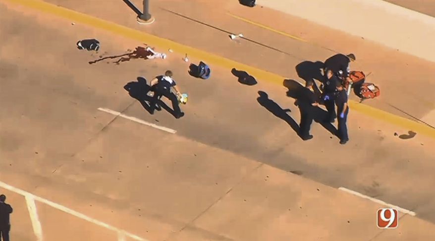 This still image taken from an aerial video provided by KWTV shows police responding to a shooting at Will Rogers World Airport in Oklahoma City, on Tuesday, Nov. 15, 2016. Police say the airport has been closed following a shooting there. Airport spokeswoman Karen Carney says all operations are suspended. (KWTV via AP)