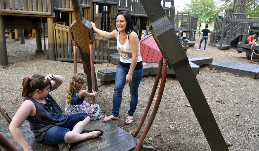 ADVANCE FOR SATURDAY, NOV. 19, 2016 - In this Thursday, Oct. 20, 2016 photo, DaNica Shirey, center, plays with daughter Aslynn Clark, second from left, and Marisa Forrey, left, at Springettsbury Township Park, in Pa. Shirey, a contestant in the seventh season of NBC's "The Voice" in 2014, recently joined The Big House Band, which performs at weddings, private parties and casinos. She additionally has plans to release an album of original music with local musician Peter Bottros. (Chris Dunn/York Daily Record via AP)