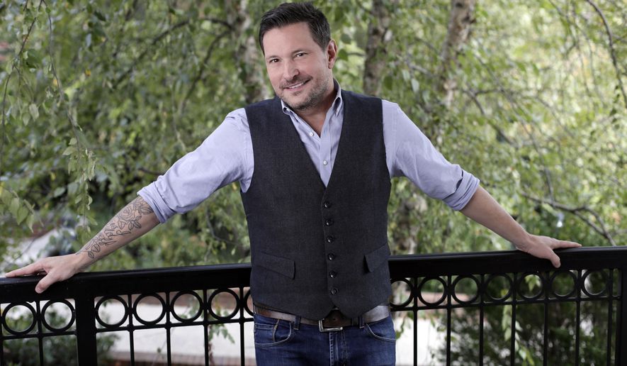In this Oct. 31, 2016 photo, Ty Herndon poses in Nashville, Tenn., to promote his latest album, “House on Fire,” released on Friday. (AP Photo/Mark Humphrey)