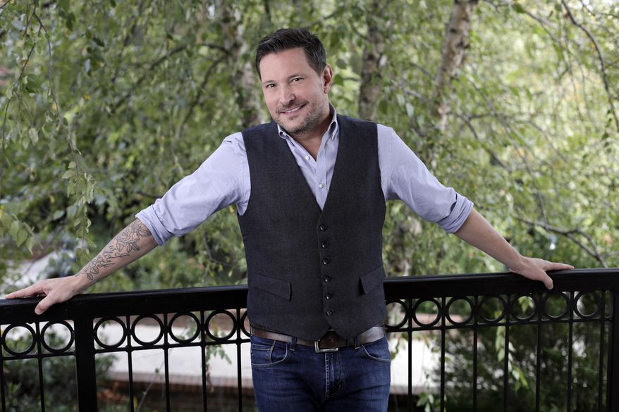 In this Oct. 31, 2016 photo, Ty Herndon poses in Nashville, Tenn., to promote his latest album, “House on Fire,” released on Friday. (AP Photo/Mark Humphrey)