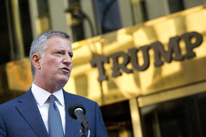 New York Mayor Bill de Blasio holds a news conference in front of Trump Tower following a meeting with President-elect Donald Trump, Wednesday, Nov. 16, 2016, in New York. De Blasio said that Trump "loves this city" and added that he urged the Republican president-elect to send a "sign of unity" to his hometown, which overwhelmingly voted for Democrat Hillary Clinton. (AP Photo/Mark Lennihan)