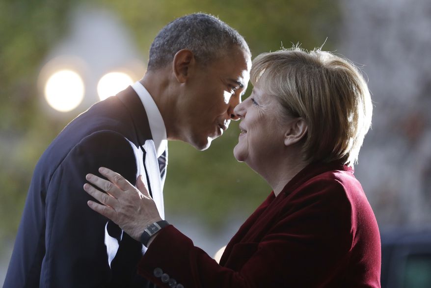 U.S. President Barack Obama, left, is welcomed by German Chancellor Angela Merkel prior to a meeting in the chancellery in Berlin, Germany, Thursday, Nov. 17, 2016. Germany is the last European stop of Obama's final tour abroad as U.S. president. (AP Photo/Michael Sohn)