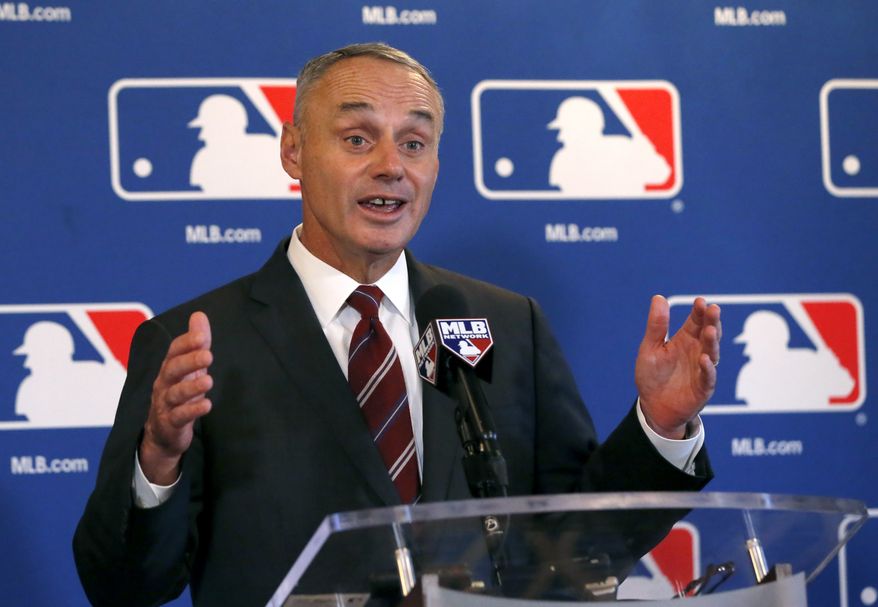 Baseball Commissioner Rob Manfred responds to a question after the baseball owners quarterly meetings at the Drake Hotel Thursday, Nov. 17, 2016, in Chicago. (AP Photo/Charles Rex Arbogast)