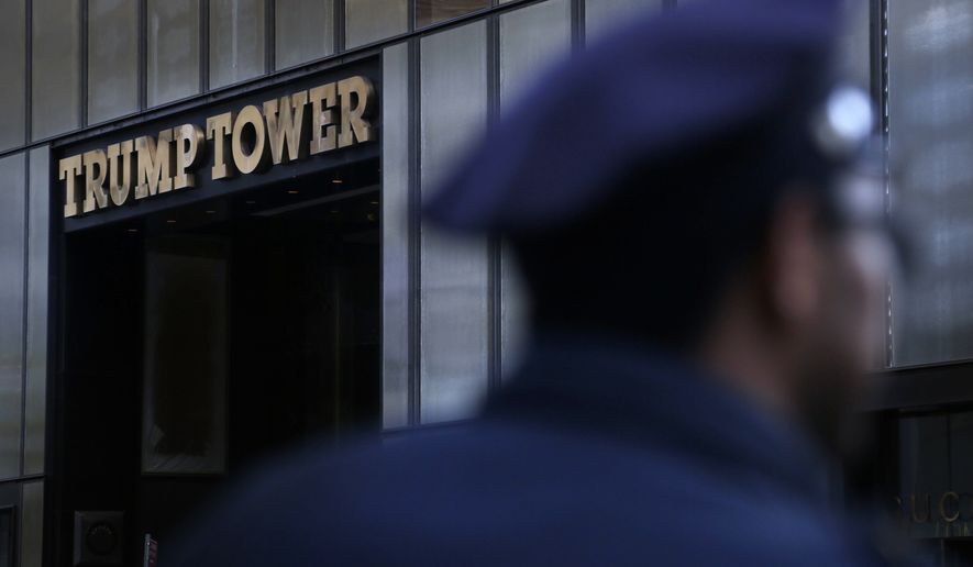 A police officer stands near Trump Tower in New York, Thursday, Nov. 17, 2016. (AP Photo/Seth Wenig)