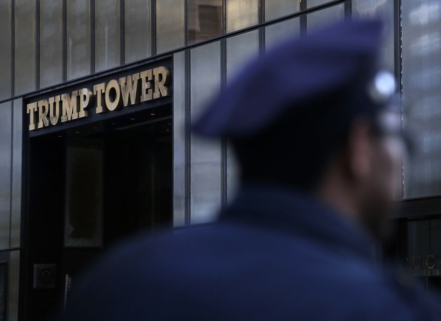 A police officer stands near Trump Tower in New York, Thursday, Nov. 17, 2016. (AP Photo/Seth Wenig)