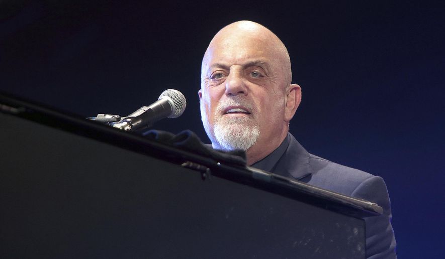 In this July 25, 2015, file photo, singer-songwriter Billy Joel performs in concert at M&amp;amp;T Bank Stadium in Baltimore. (Photo by Owen Sweeney/Invision/AP, File)