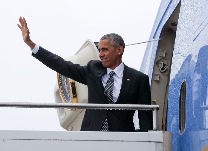 US President Barack Obama waves as he boards Air Force One during his departure from Tegel International Airport in Berlin, Friday, Nov. 18, 2016. Obama is leaving Europe and heading to South America to attend the annual Asia Pacific Economic Cooperation (APEC) forum, taking place in Lima, Peru. (AP Photo/Pablo Martinez Monsivais)