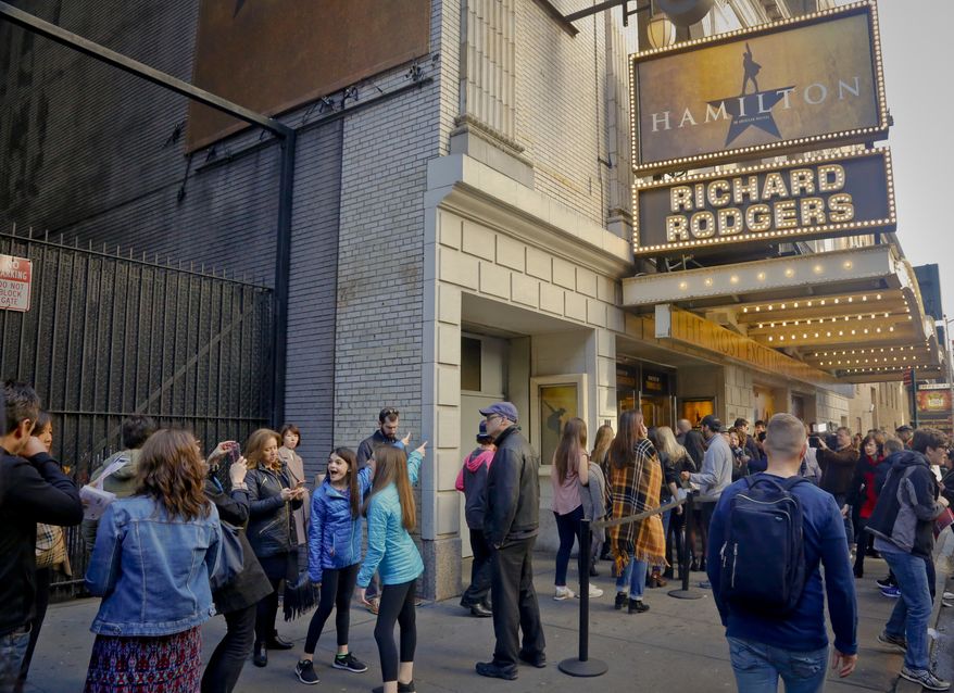 People line-up to see the Broadway play "Hamilton," Saturday Nov. 19, 2016, in New York. President-elect Donald Trump demanded an apology from the cast of the hit musical a day after an actor lectured Vice President-elect Mike Pence about equality, prompting angry responses from liberals and conservatives. (AP Photo/Bebeto Matthews)