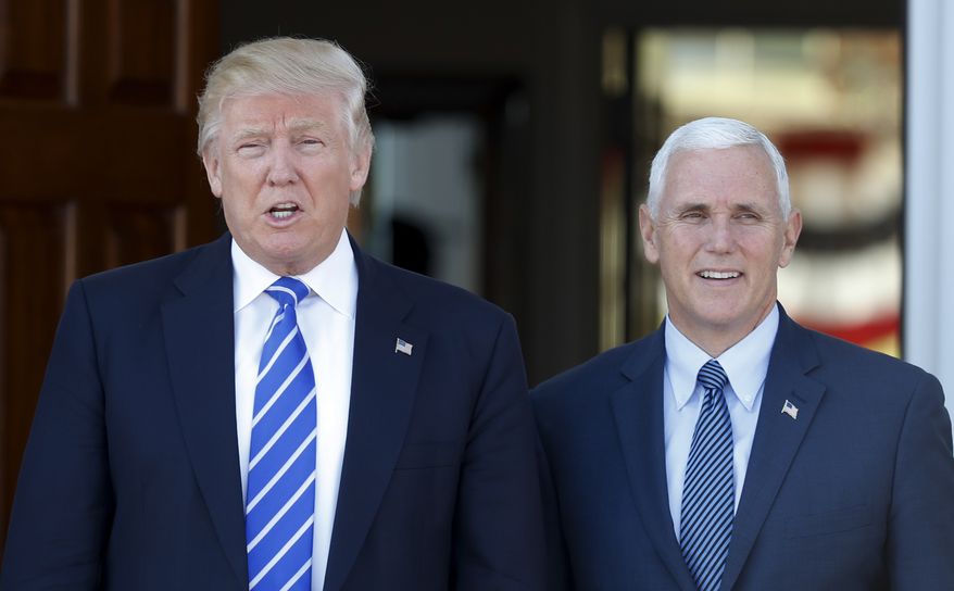 President-elect Donald Trump and Vice President-elect Mike Pence pause for photographs as they arrive at the Trump National Golf Club Bedminster clubhouse in Bedminster, N.J., Saturday, Nov. 19, 2016. (AP Photo/Carolyn Kaster)