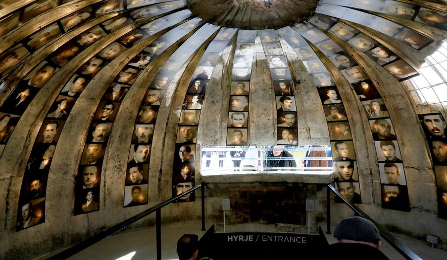 Photographs illustrating the political persecution of some 100,000 Albanians from 1945 until 1991 during the former communist regime cover the walls of a bunker at a new museum in the capital, Tirana, Saturday, Nov. 19, 2016. The former top-secret nuclear bunker has been reopened as a museum in Albania’s capital to show visitors how Communist-era police persecuted the regime's opponents. (AP Photo/Hektor Pustina)