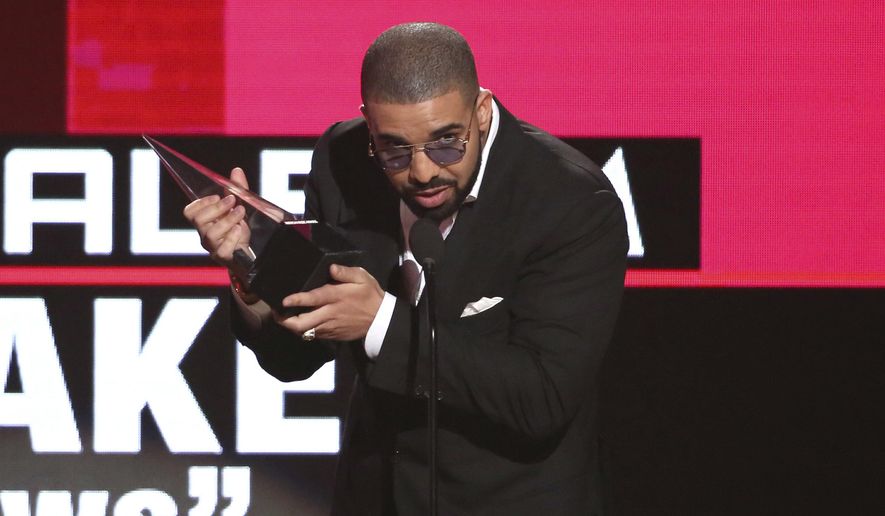 Drake accepts the award for favorite album rap/hip-hop for "Views" at the American Music Awards at the Microsoft Theater on Sunday, Nov. 20, 2016, in Los Angeles. (Photo by Matt Sayles/Invision/AP)