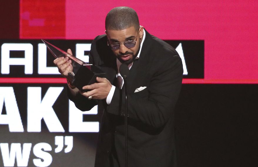 Drake accepts the award for favorite album rap/hip-hop for "Views" at the American Music Awards at the Microsoft Theater on Sunday, Nov. 20, 2016, in Los Angeles. (Photo by Matt Sayles/Invision/AP)