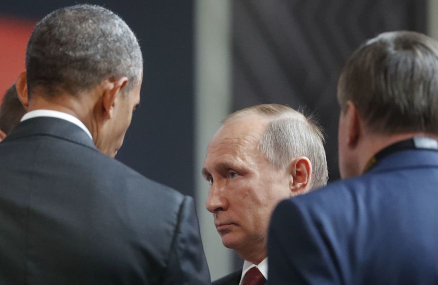 U.S. President Barack Obama, left, talks with Russia's President Vladimir Putin, center, and Kremlin foreign affairs adviser Yuri Ushakov, right, at the opening session of the Asia-Pacific Economic Cooperation (APEC) in Lima, Peru, Sunday, Nov. 20, 2016. (AP Photo/Pablo Martinez Monsivais)