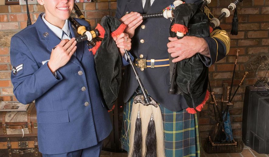 In this Nov. 7, 2016 photo, Air Guard Senior Airman Mariah Connell and her father, Sgt. 1st Class Michael Connell pose for a photo in a living room holding their military bagpipes in Reno, Nev. Michael Connell served for the Nevada Air National Guard, and now he serves in the U.S. Army. Connell, the only military bagpiper in Nevada, will retire by the end of this year, reported the Reno Gazette-Journal. After he retires, his daughter, Mariah Connell, 23, will take over as the only military piper in Nevada. (Mike Higdon/The Reno Gazette-Journal via AP)