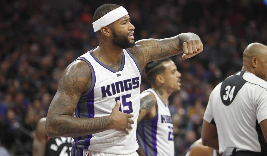Sacramento Kings center DeMarcus Cousins looks for an explanation from an official after fouling a Toronto Raptor player during the first half of an NBA basketball game in Sacramento, Calif., Sunday, Nov. 20, 2016. (AP Photo/Steve Yeater)